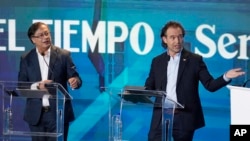 Debate presidencial entre Federico Gutiérrez, candidato presidencial que representa a la coalición Equipo por Colombia, derecha, y el aspirante presidencial Gustavo Petro de la coalición Pacto Histórico. (AP/Fernando Vergara)